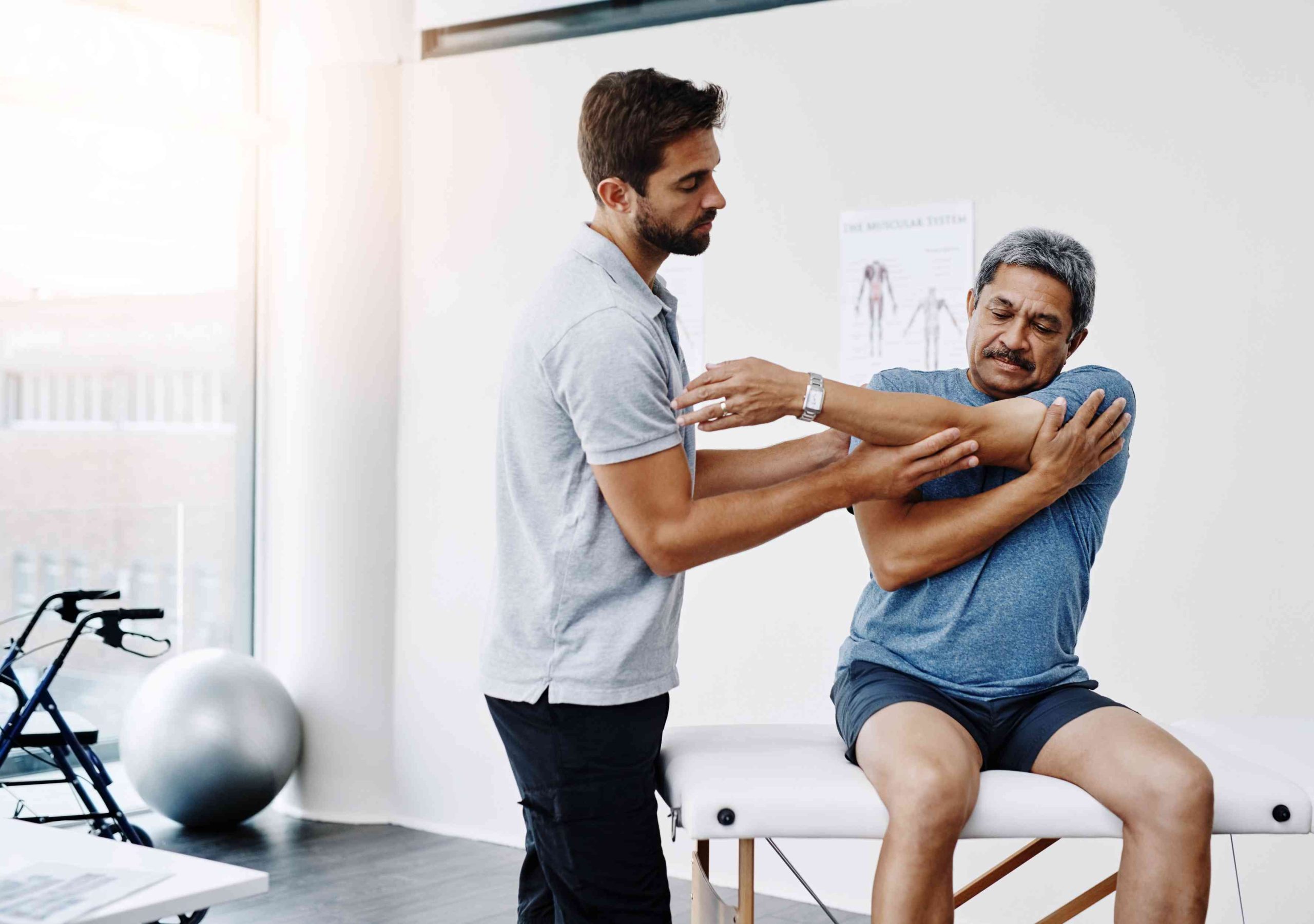 Physiotherapist guiding patient through treatment process at Enspire Physio Calgary clinic